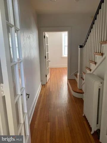 a view of entryway with wooden floor