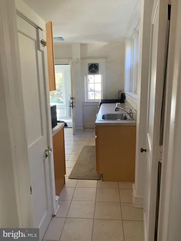 a view of a hallway with washer and dryer