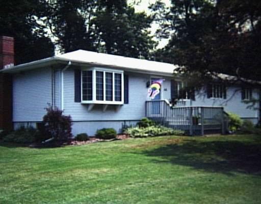 45 Alexander Road Milford, CT 06461 - Photo 1 of 1 a front view of a house with a garden