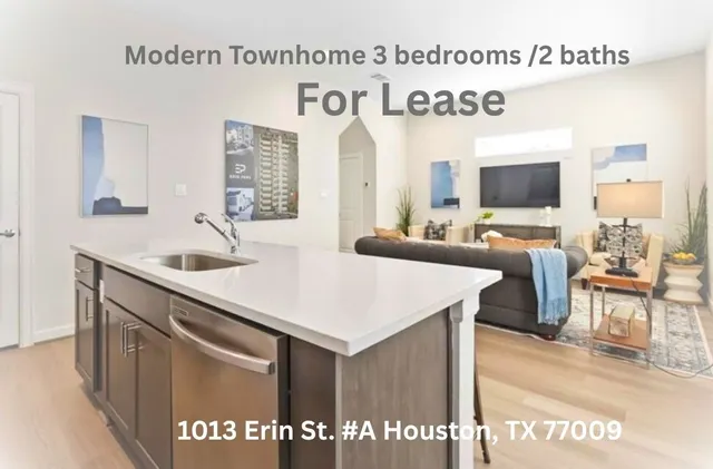 a view of living room with granite countertop furniture and flat screen tv