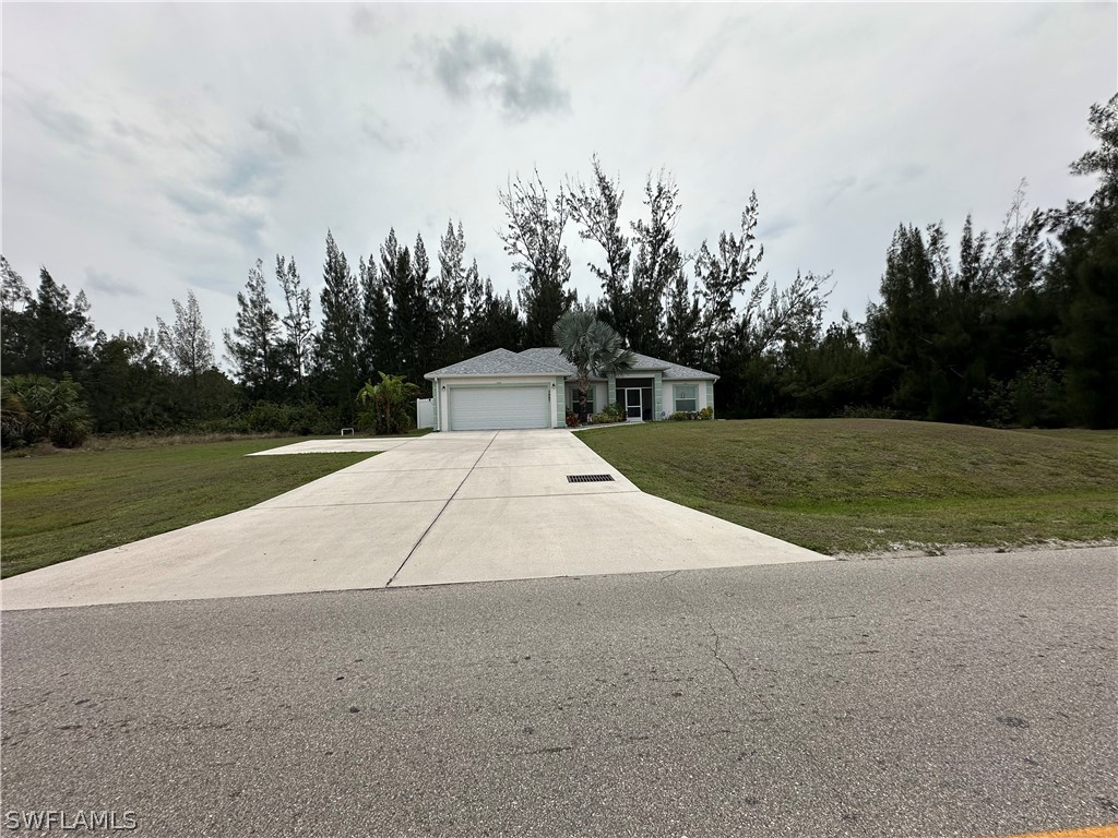 3987 Sunset Road Lehigh Acres, FL 33971 - Photo 2 of 2 a view of outdoor space and yard