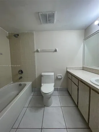 a bathroom with a sink a toilet and bathtub