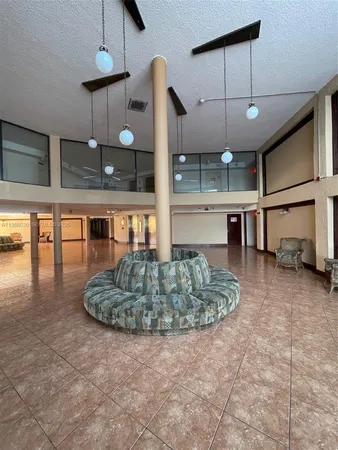 a room with lots of potted plants