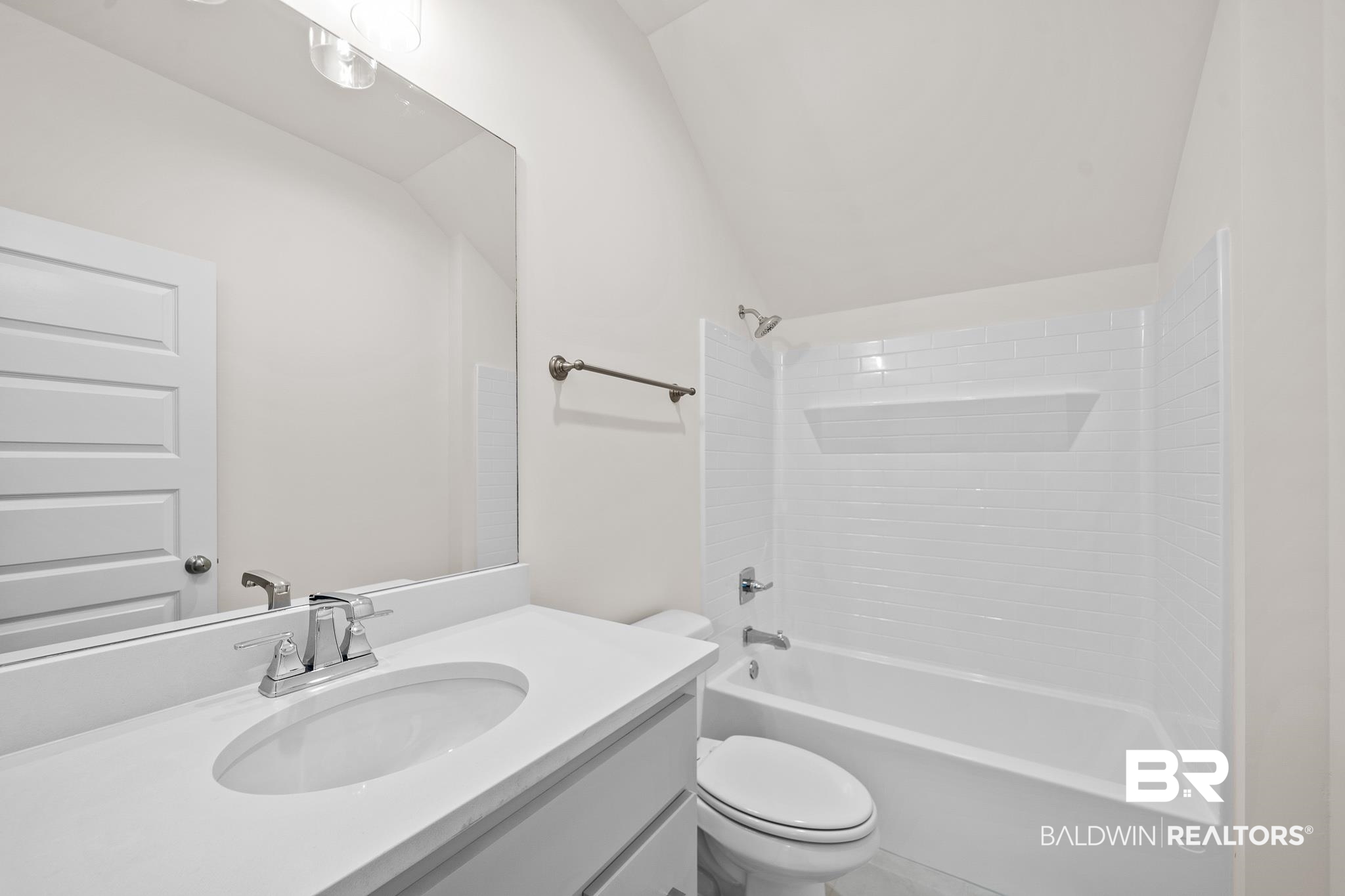 29 Signal Hill Road Daphne, AL 36527 - Photo 27 of 36 Full bathroom with vanity, lofted ceiling, toilet, and shower / washtub combination