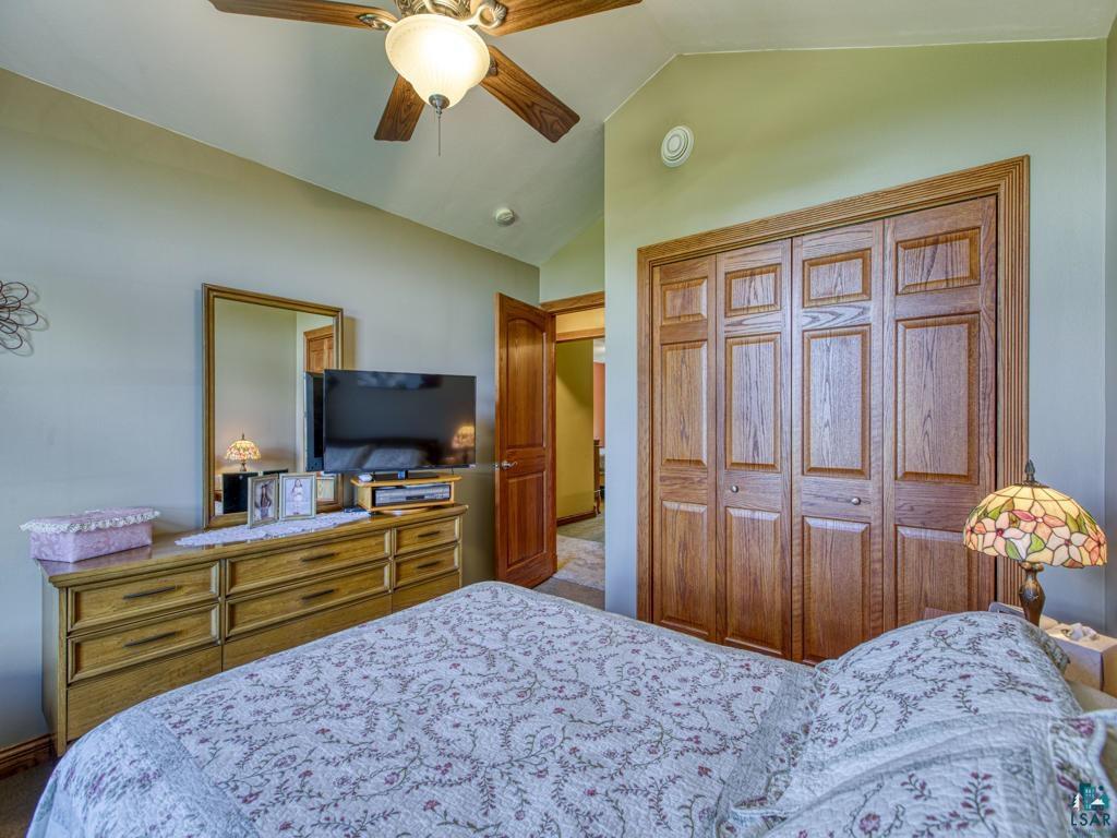 4678 Ridgeview Drive Superior, WI 54880 - Photo 22 of 43 Bedroom featuring carpet, ceiling fan, and lofted ceiling