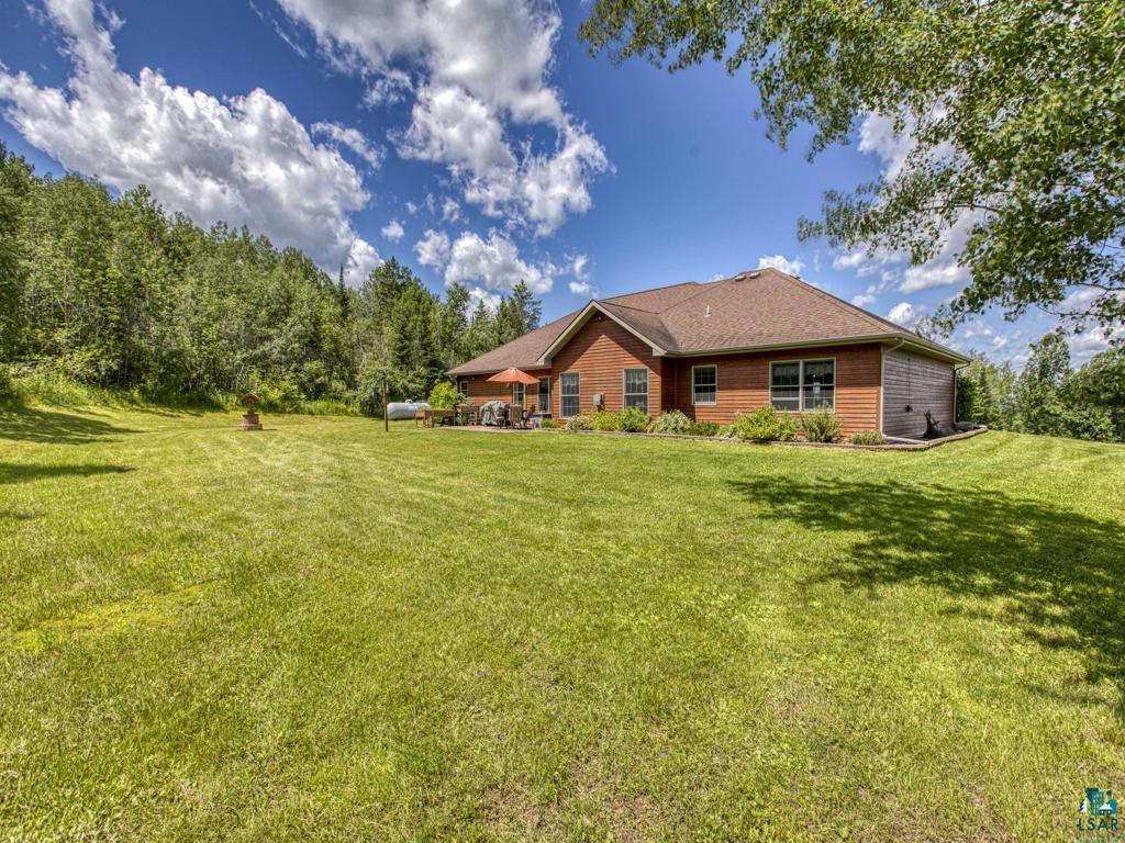 4678 Ridgeview Drive Superior, WI 54880 - Photo 28 of 43 Rear view of house with a lawn