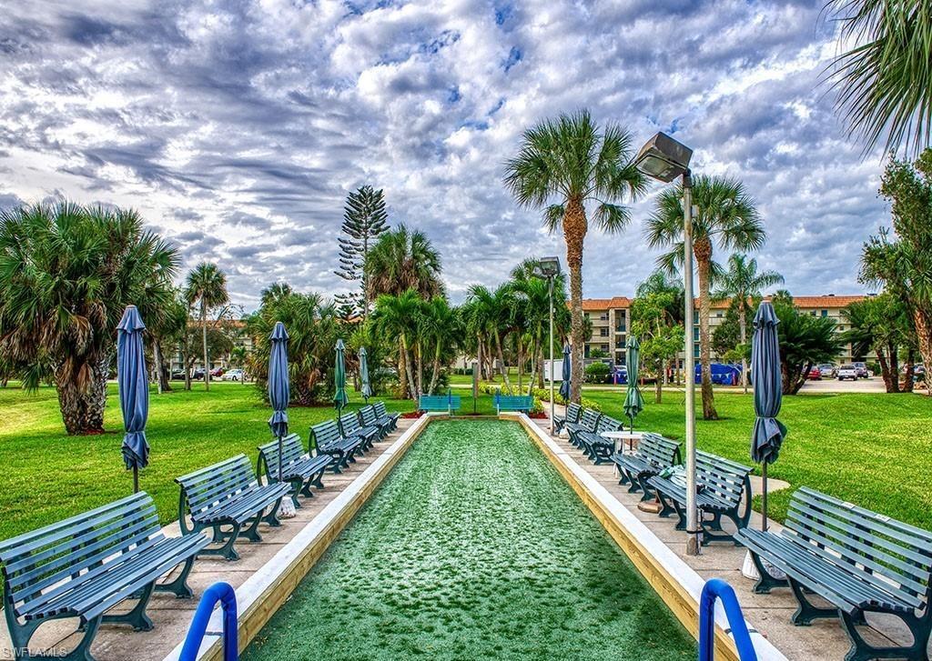 4346 27th Court Southwest, Unit 5 Naples, FL 34116 - Photo 13 of 18 a view of a backyard with a garden