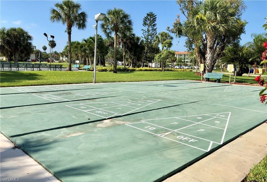 4346 27th Court Southwest, Unit 5 Naples, FL 34116 - Photo 16 of 18 a view of a tennis court