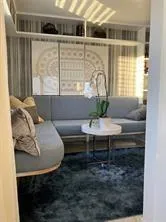 a living room with furniture and a window