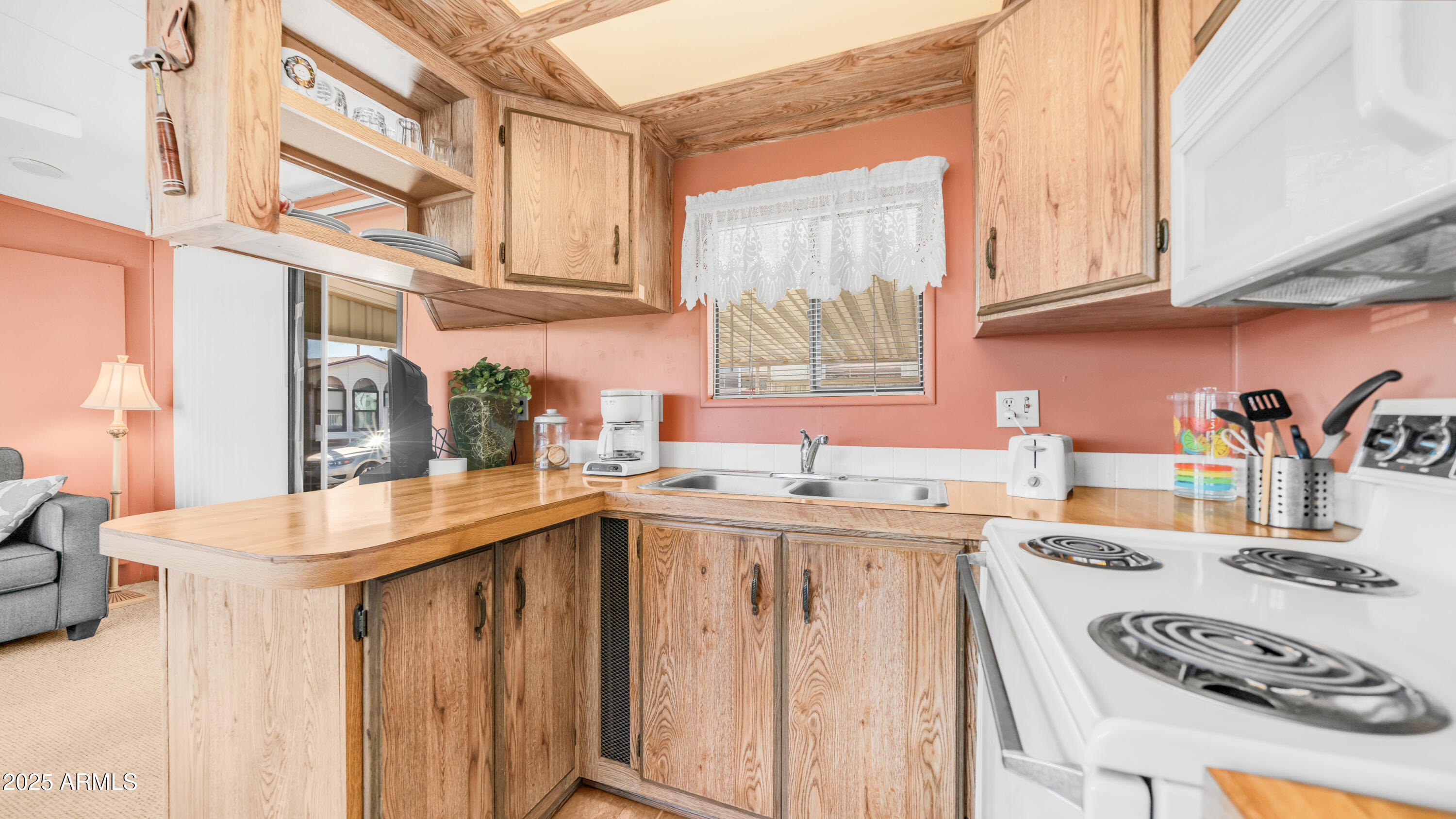 502 Jaspar Drive Apache Junction, AZ 85119 - Photo 12 of 54 a kitchen with stainless steel appliances granite countertop a sink and cabinets