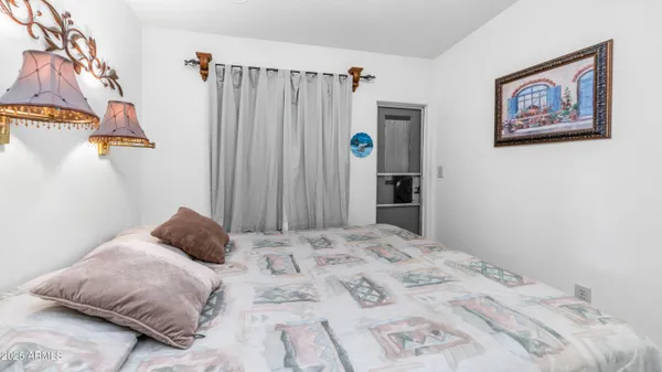 a bedroom with a bed and a cabinets