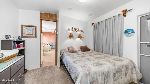 a bathroom with a toilet and a shower curtain