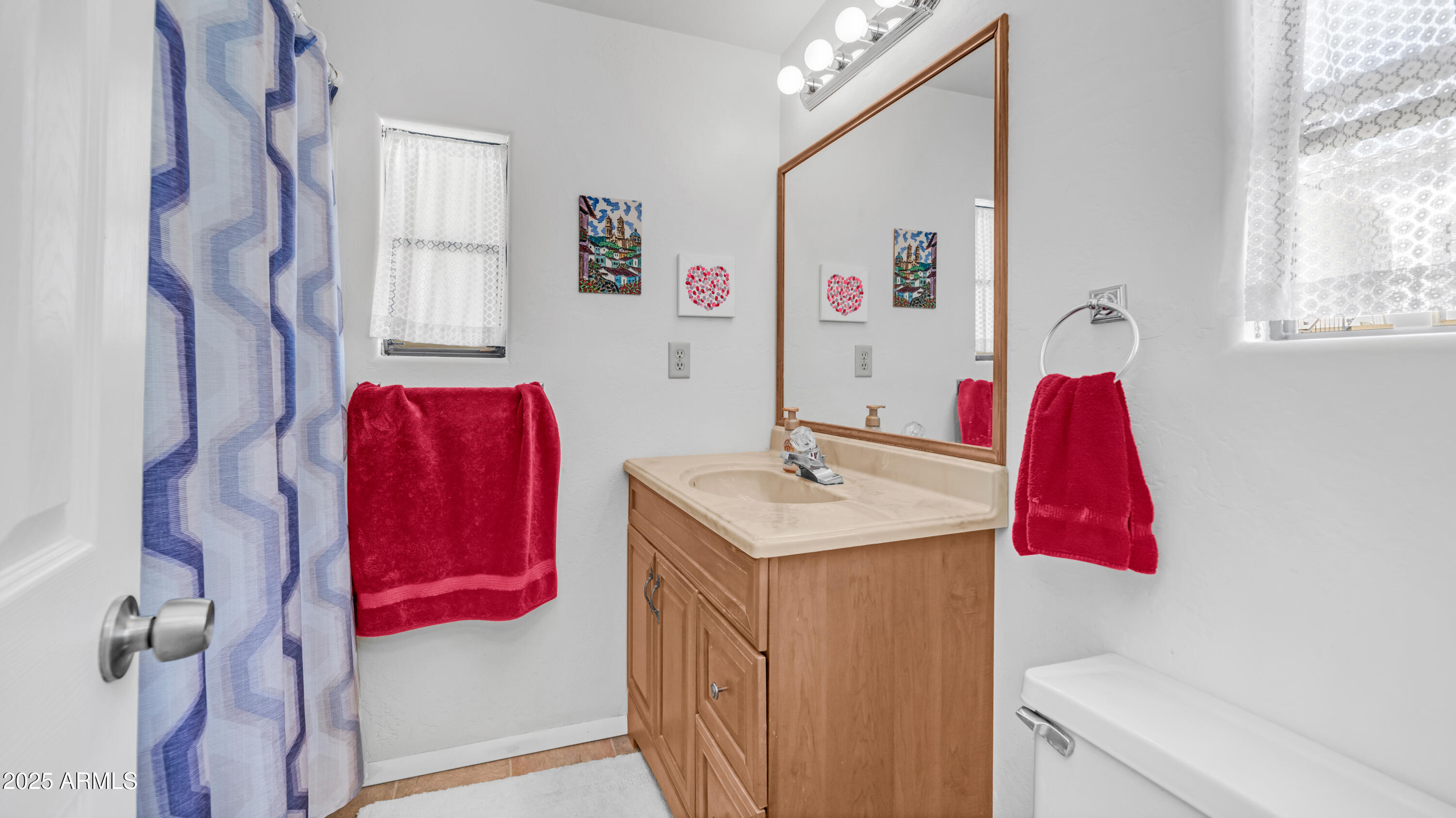502 Jaspar Drive Apache Junction, AZ 85119 - Photo 19 of 54 a hall with a sink vanity and mirror