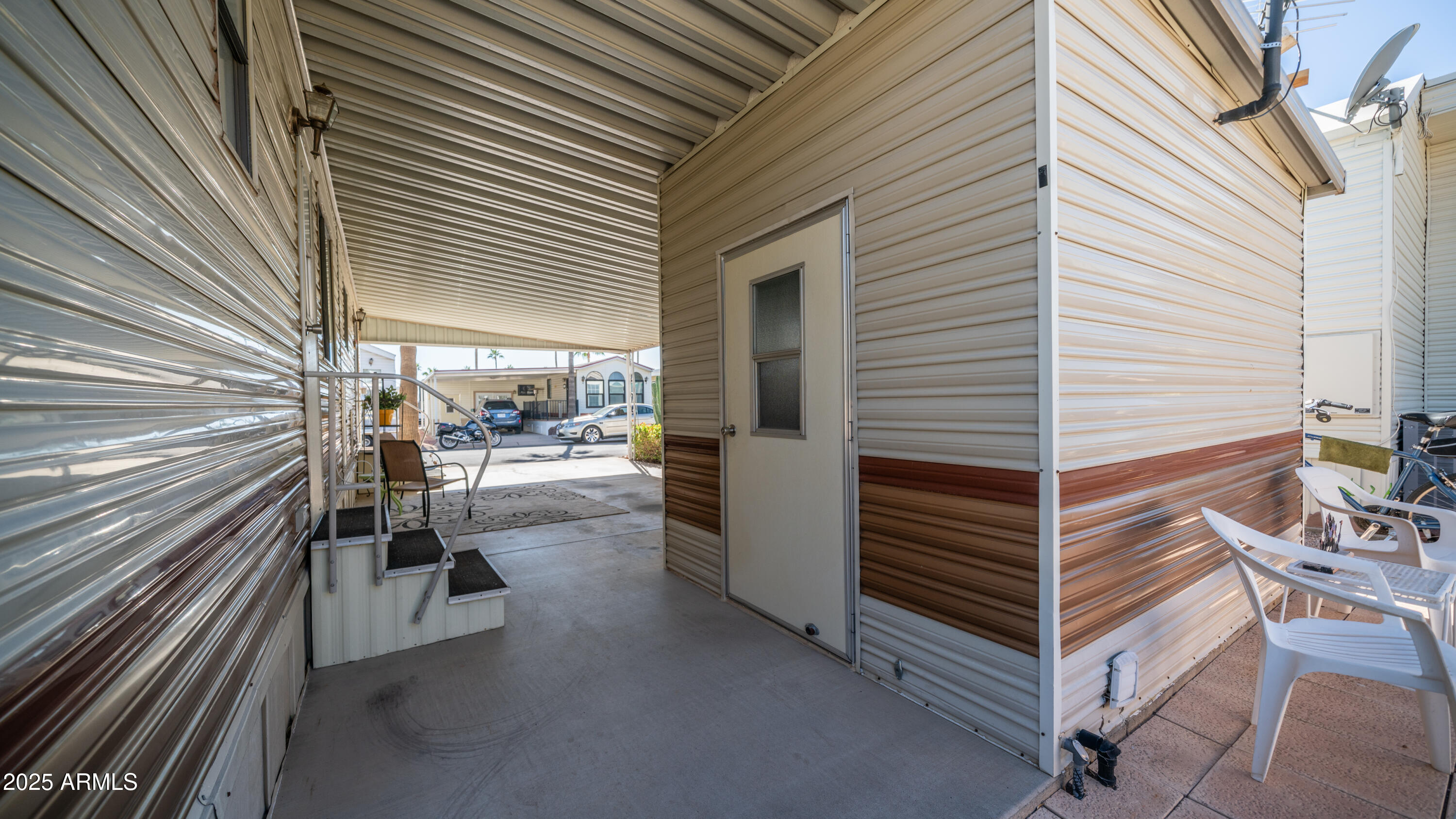 502 Jaspar Drive Apache Junction, AZ 85119 - Photo 20 of 54 a view of a patio with table and chairs in the patio