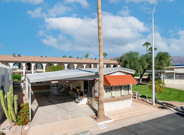 an outdoor space with swimming pool and furniture