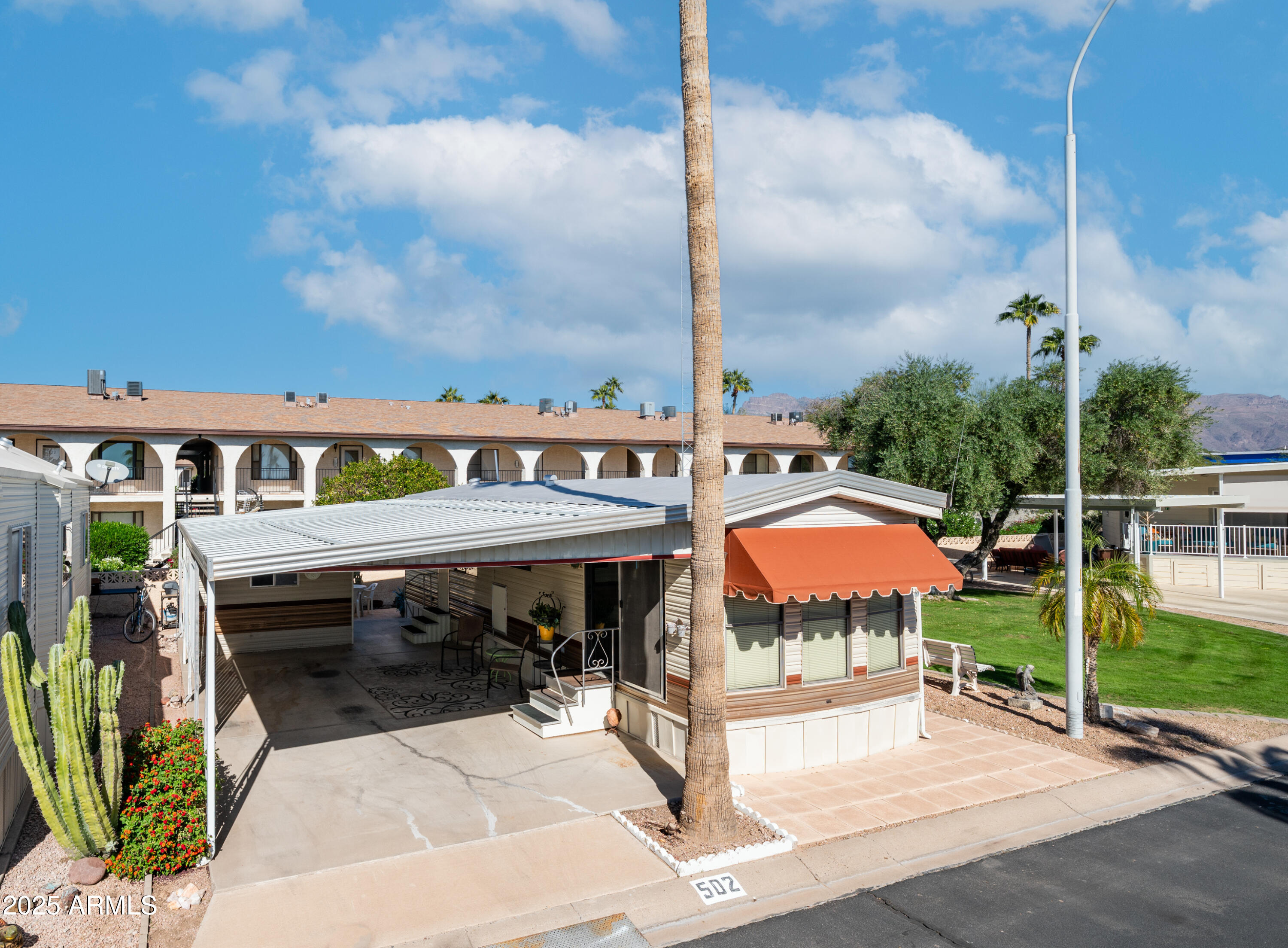 502 Jaspar Drive Apache Junction, AZ 85119 - Photo 2 of 54 an outdoor space with swimming pool and furniture