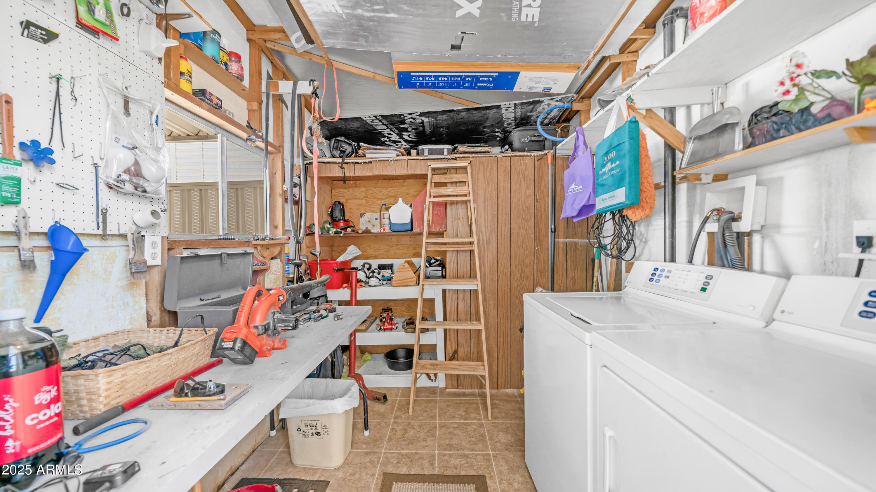 502 Jaspar Drive Apache Junction, AZ 85119 - Photo 21 of 54 a utility room with stainless steel appliances and wooden floor