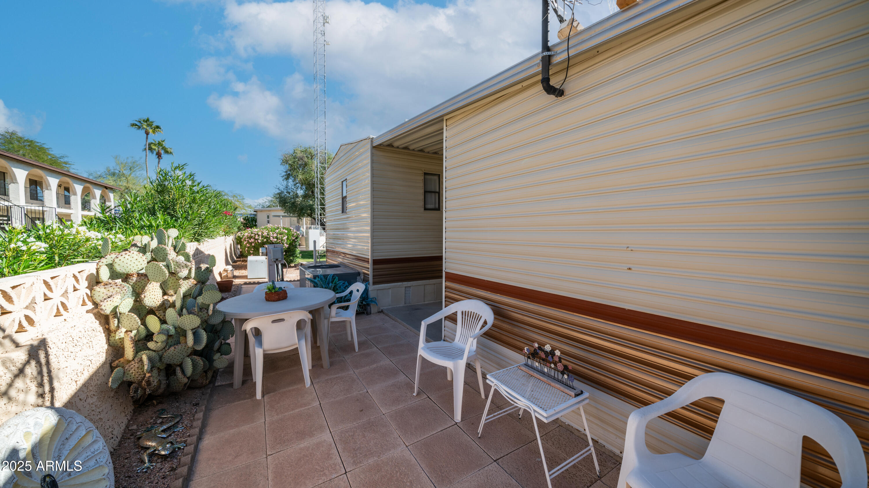 502 Jaspar Drive Apache Junction, AZ 85119 - Photo 22 of 54 a backyard of a house with outdoor seating