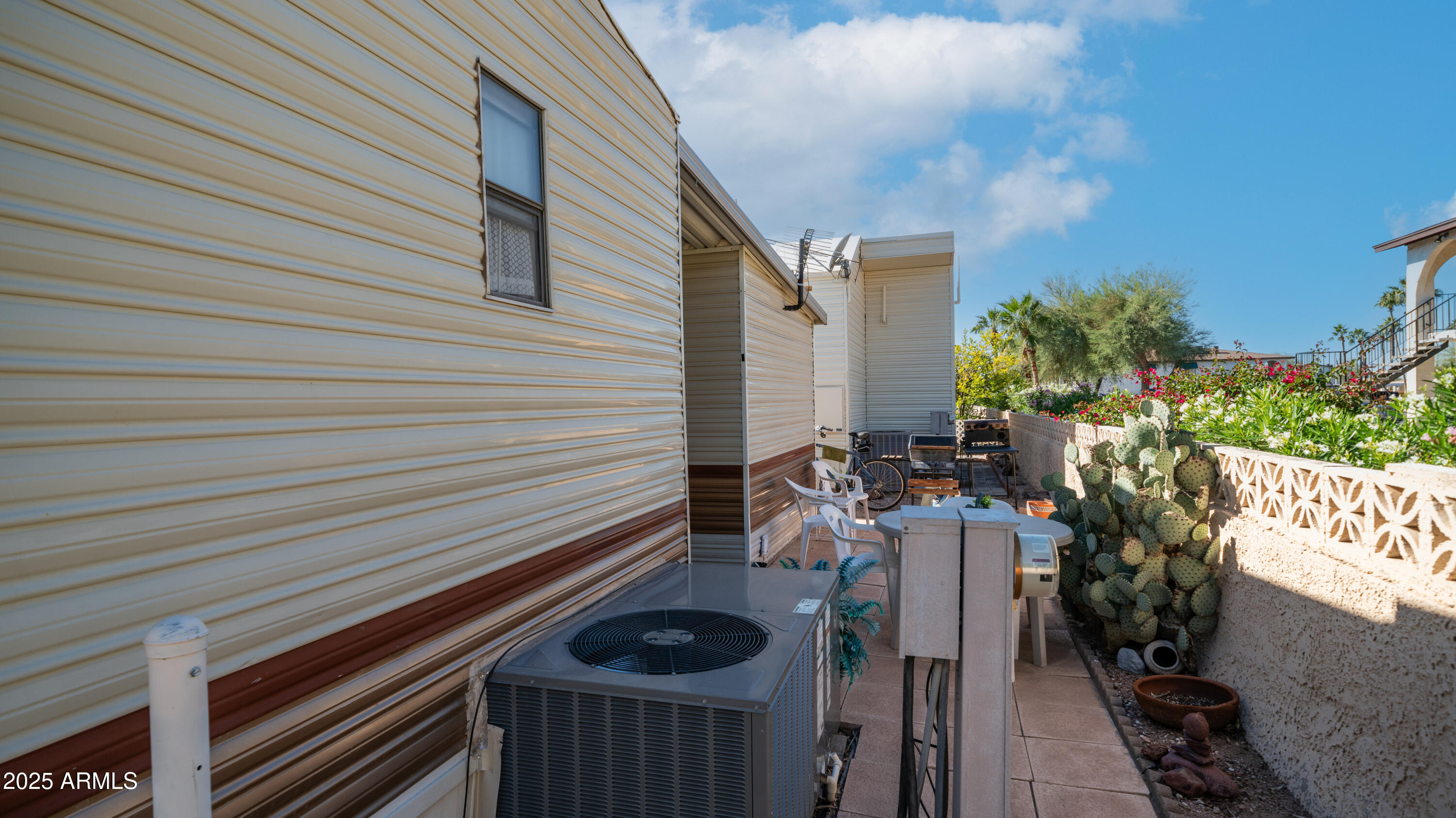 502 Jaspar Drive Apache Junction, AZ 85119 - Photo 23 of 54 a view of a patio with wooden chairs