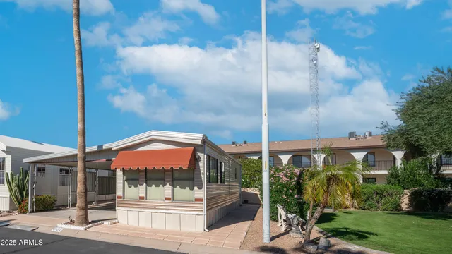 a view of a house with a large windows and stairs