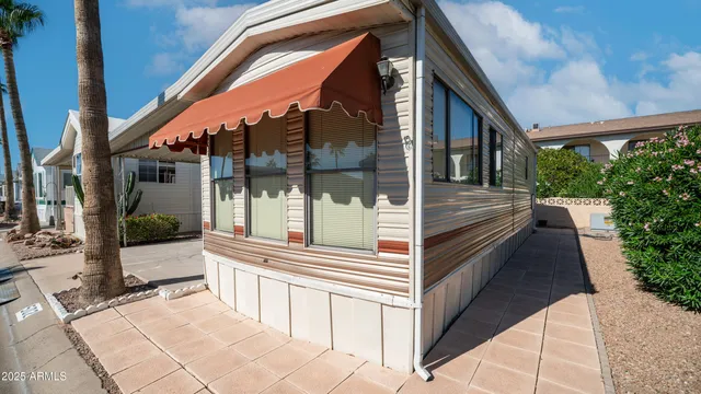 a backyard of a house with barbeque oven table and chairs