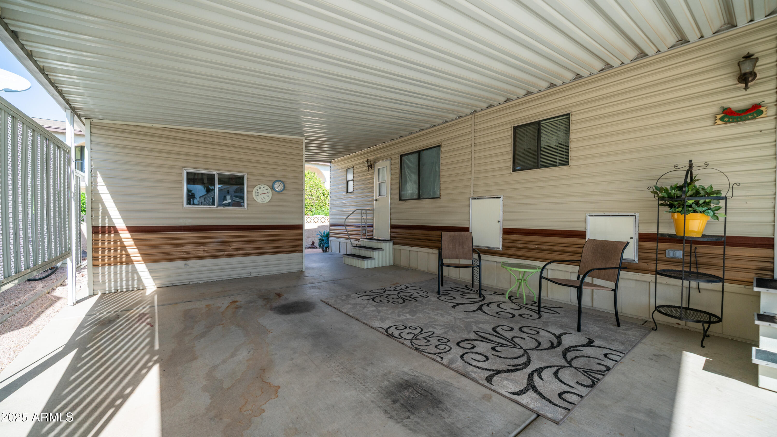 502 Jaspar Drive Apache Junction, AZ 85119 - Photo 7 of 54 a backyard of a house with barbeque oven table and chairs