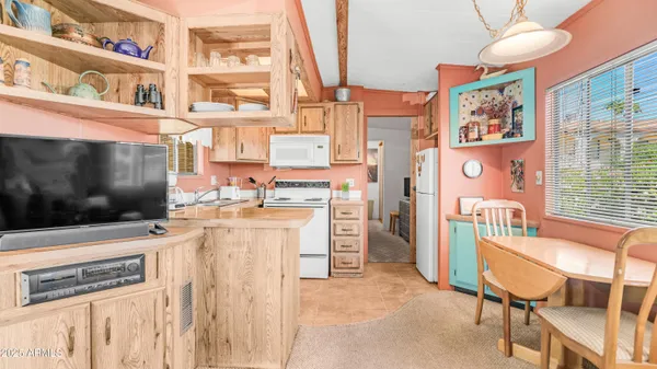 a kitchen with a cabinets and appliances