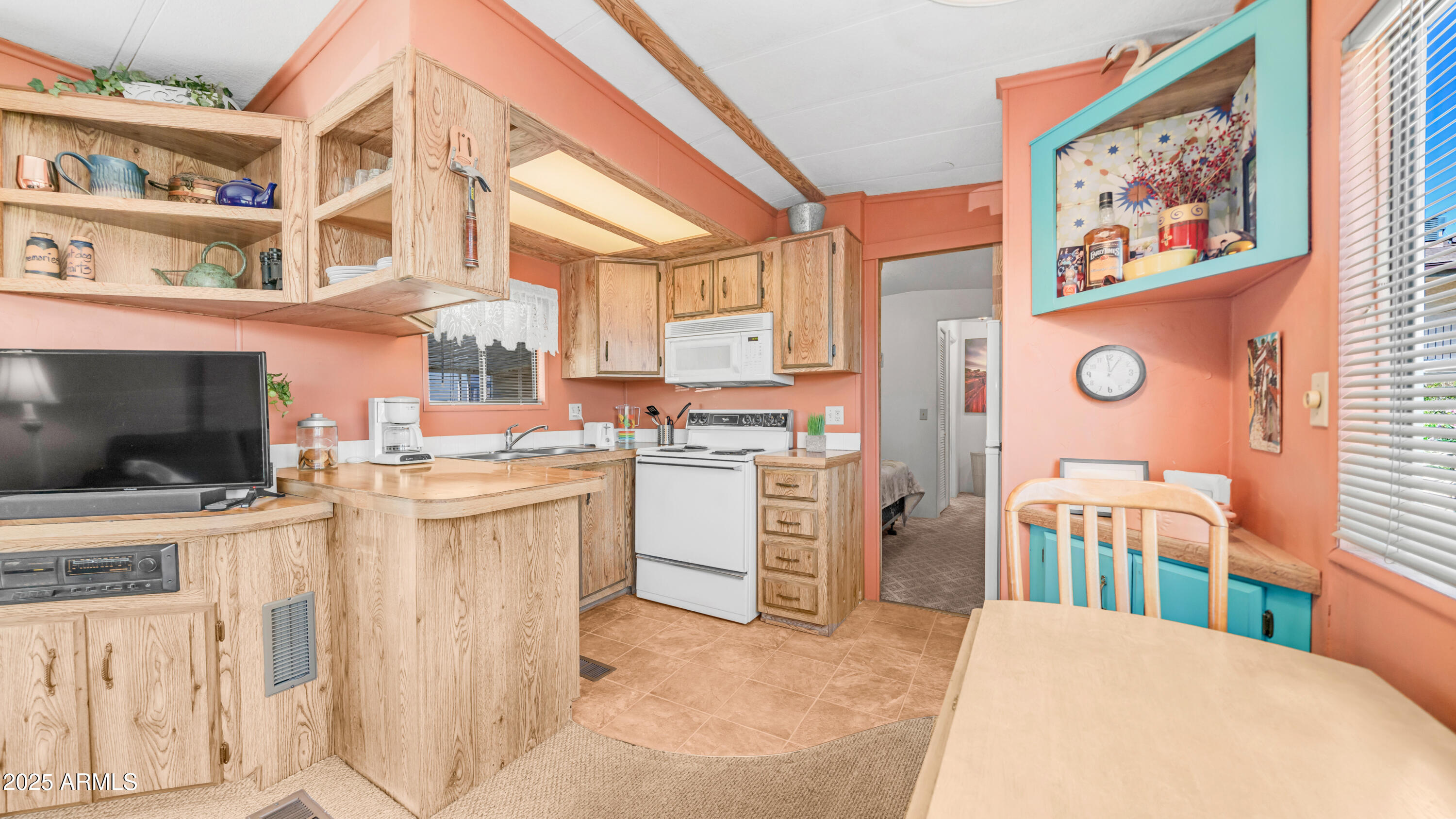 502 Jaspar Drive Apache Junction, AZ 85119 - Photo 10 of 54 a kitchen that has a lot of cabinets in it and appliances