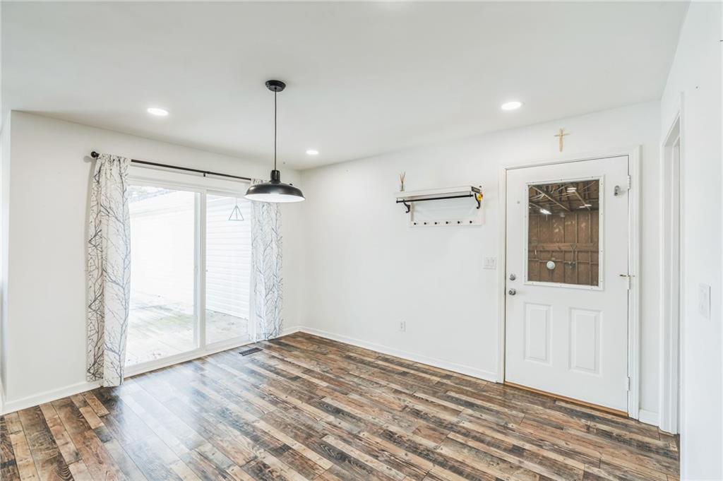 500 Coleman Mill Road Carrollton, GA 30116 - Photo 12 of 83 a view of empty room with wooden floor and fan