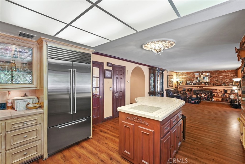19317 Vista Grande Way Porter Ranch, CA 91326 - Photo 13 of 53 a kitchen with stainless steel appliances granite countertop a refrigerator a sink and a stove