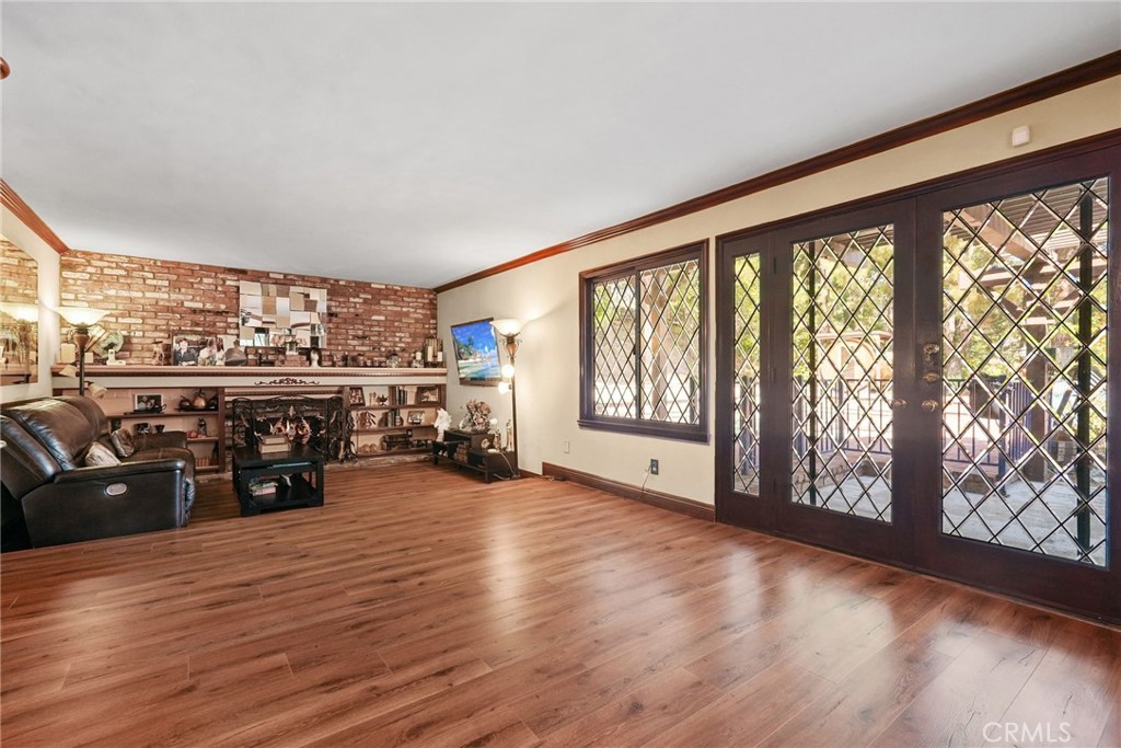 19317 Vista Grande Way Porter Ranch, CA 91326 - Photo 15 of 53 an empty room with wooden floor and furniture