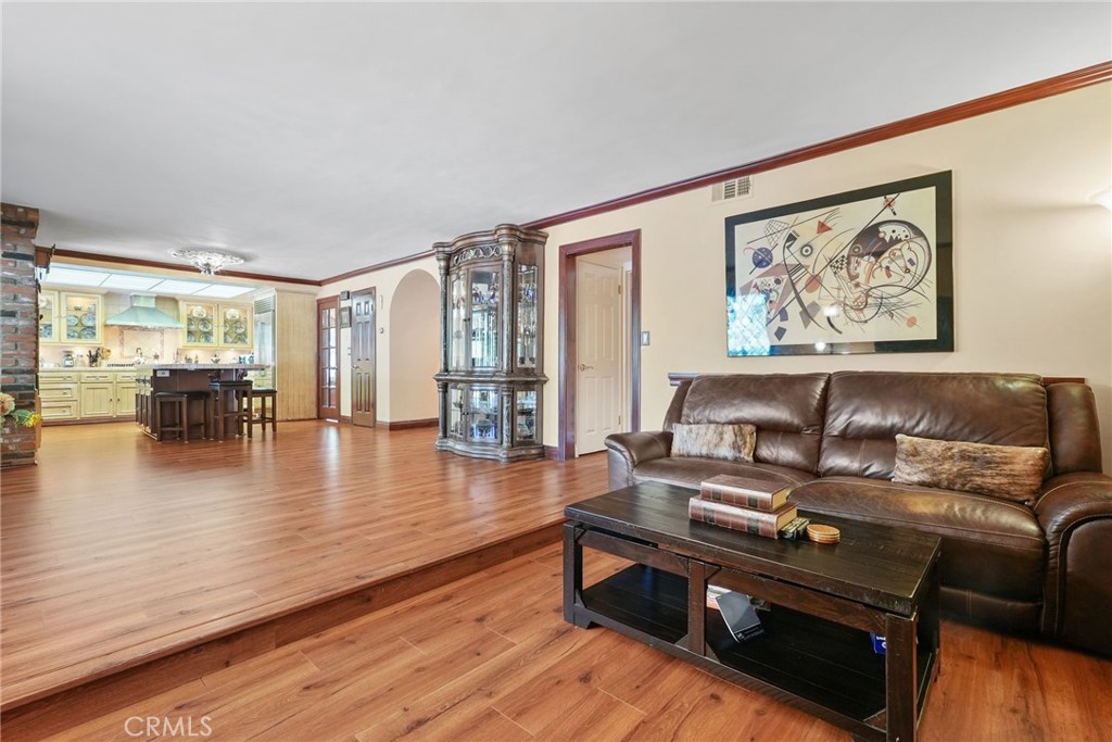 19317 Vista Grande Way Porter Ranch, CA 91326 - Photo 16 of 53 a living room with furniture and a wooden floor