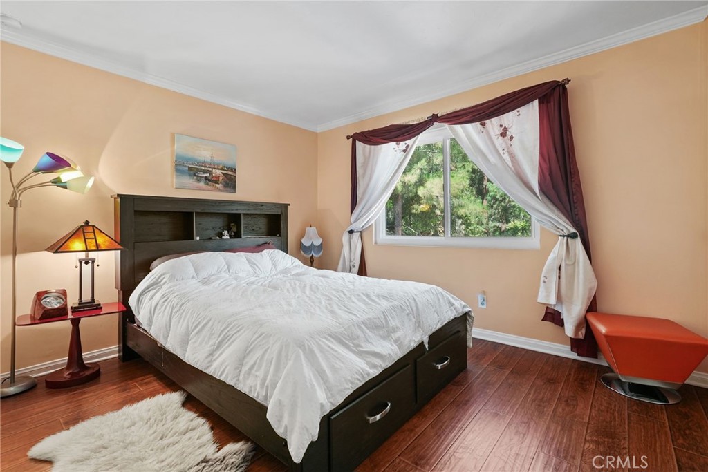 19317 Vista Grande Way Porter Ranch, CA 91326 - Photo 20 of 53 a bed sitting in a bedroom next to a window