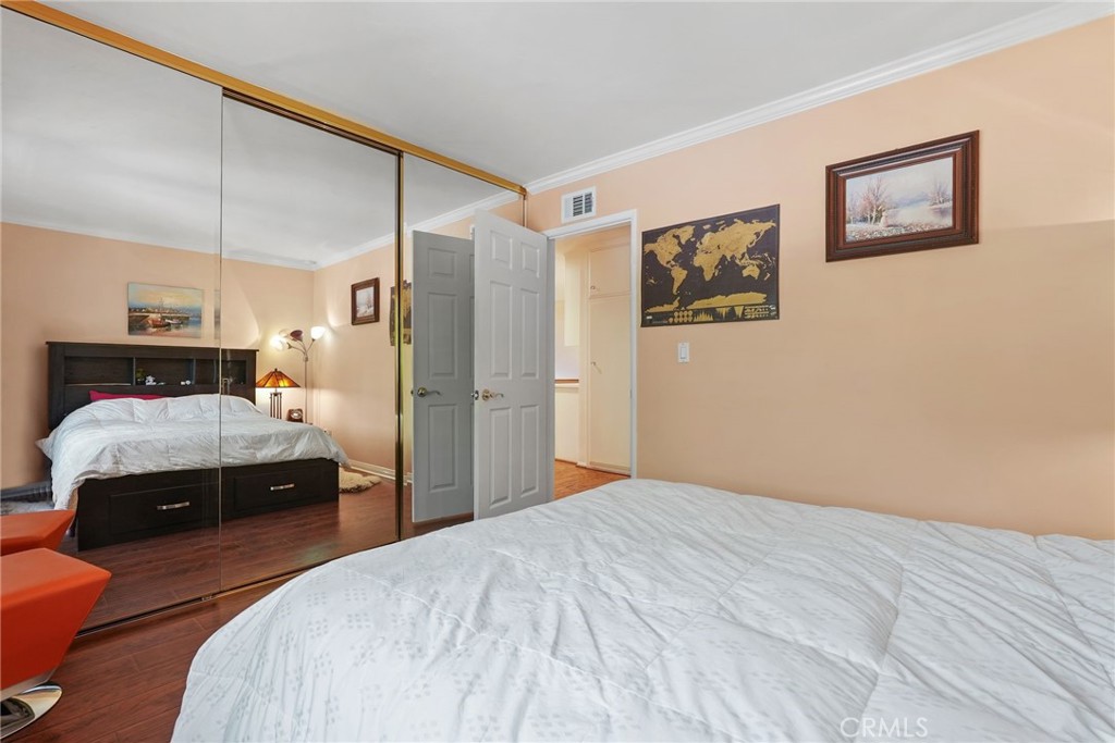 19317 Vista Grande Way Porter Ranch, CA 91326 - Photo 21 of 53 a bedroom with a bed and a painting on the wall