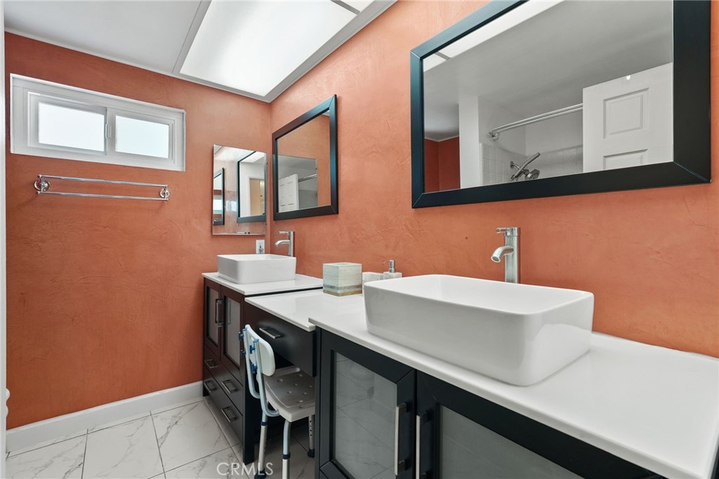 19317 Vista Grande Way Porter Ranch, CA 91326 - Photo 22 of 53 a bathroom with a sink and a mirror