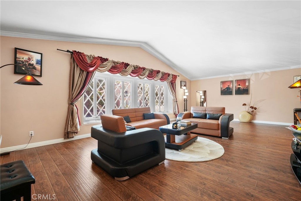 19317 Vista Grande Way Porter Ranch, CA 91326 - Photo 23 of 53 a living room with furniture and a wooden floor