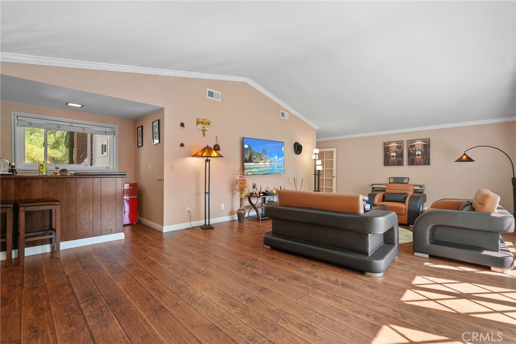 19317 Vista Grande Way Porter Ranch, CA 91326 - Photo 24 of 53 a living room with furniture and a wooden floor