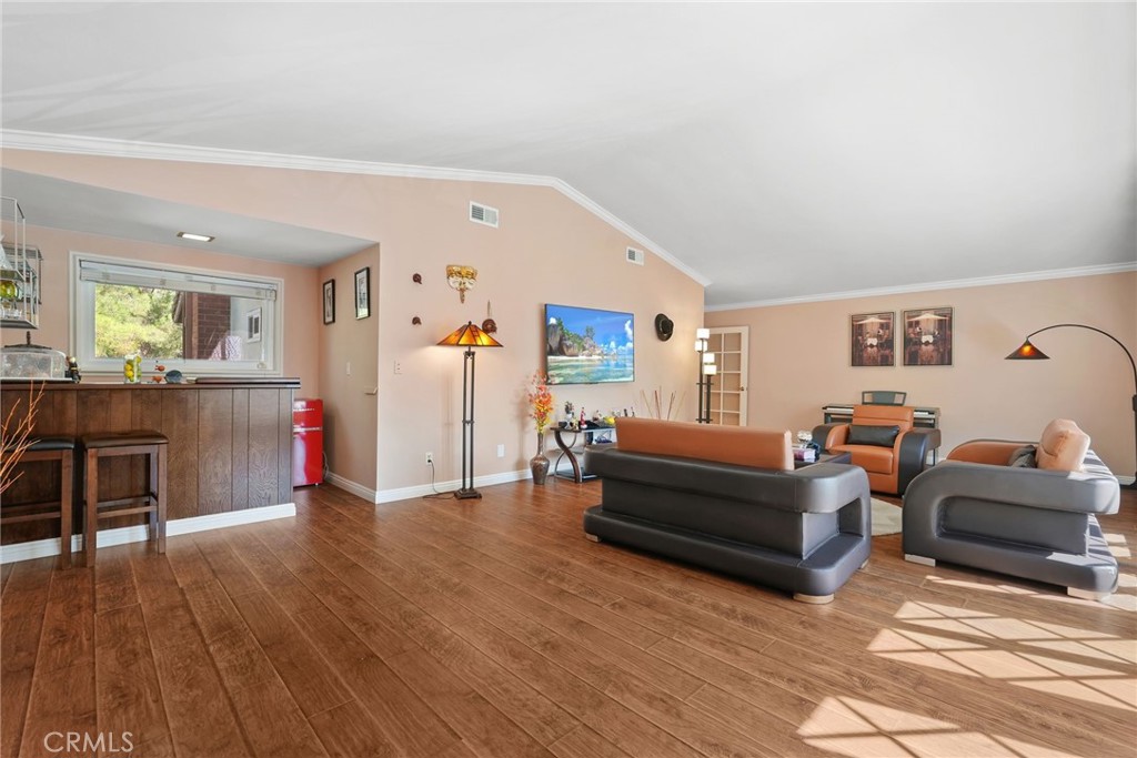 19317 Vista Grande Way Porter Ranch, CA 91326 - Photo 27 of 53 a living room with furniture and a wooden floor
