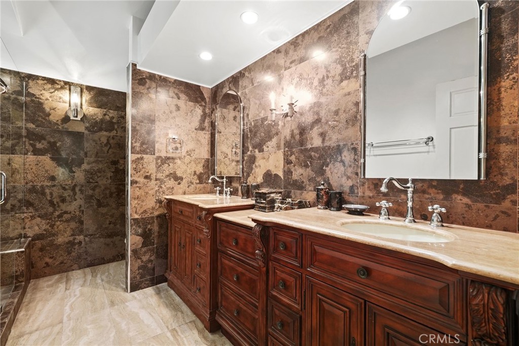 19317 Vista Grande Way Porter Ranch, CA 91326 - Photo 30 of 53 a bathroom with a double vanity sink mirror and double