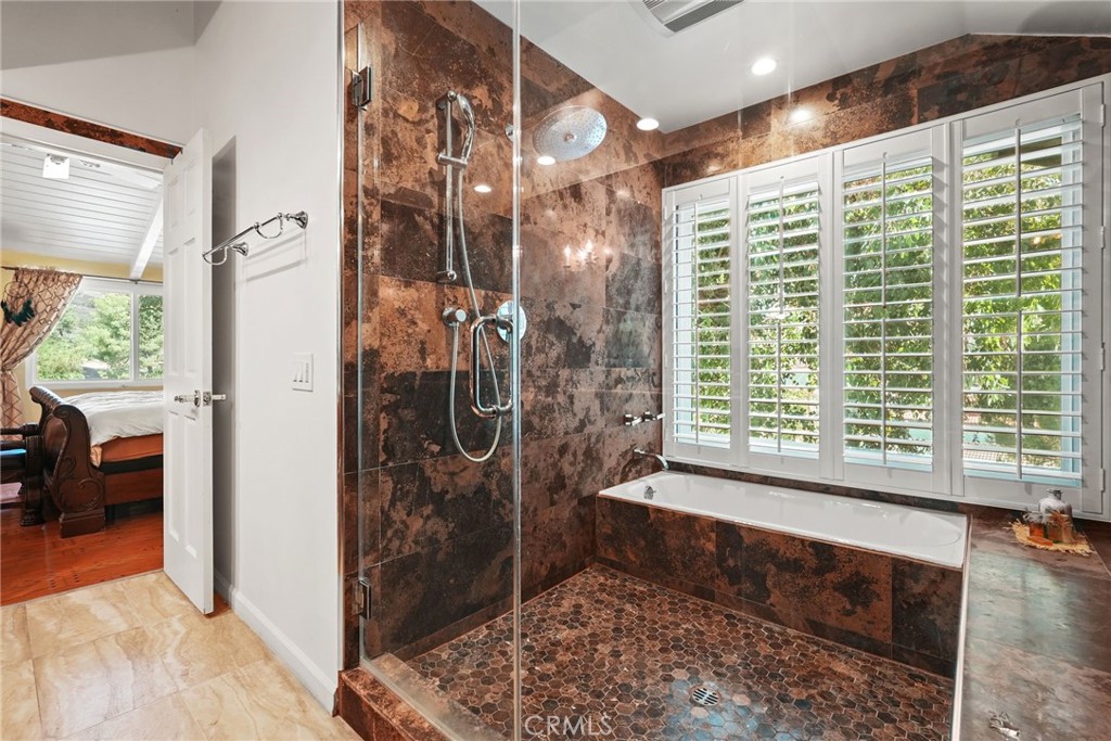 19317 Vista Grande Way Porter Ranch, CA 91326 - Photo 31 of 53 a bathroom with a bathtub and a shower