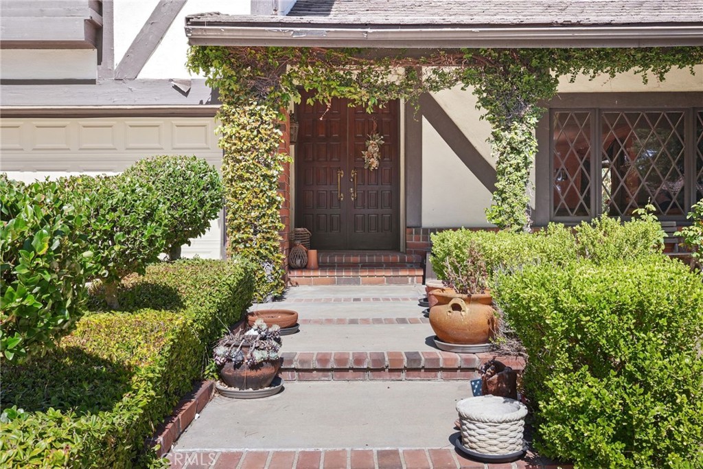 19317 Vista Grande Way Porter Ranch, CA 91326 - Photo 4 of 53 a view of a porch with chair and potted plants