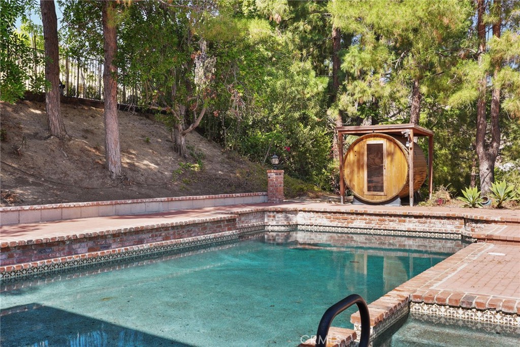 19317 Vista Grande Way Porter Ranch, CA 91326 - Photo 41 of 53 a view of a swimming pool with a patio