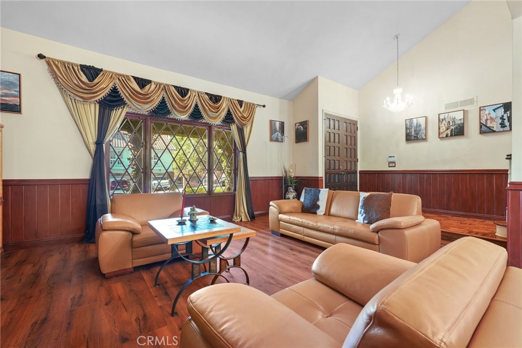 19317 Vista Grande Way Porter Ranch, CA 91326 - Photo 7 of 53 a living room with furniture and a wooden floor