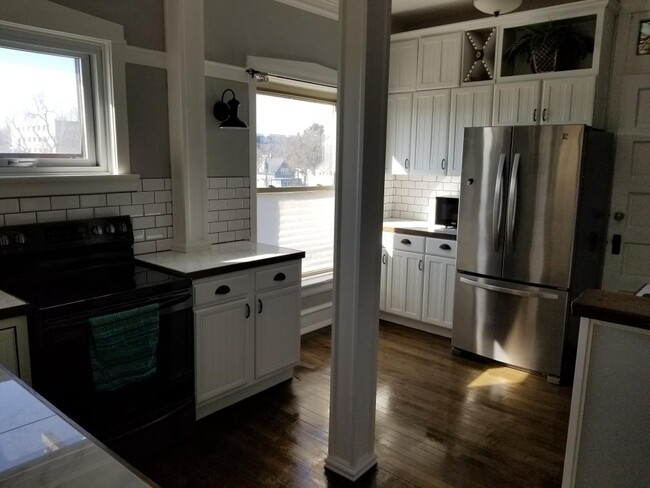 1150 Washington Boulevard, Unit 3 Oak Park, IL 60302 - Photo 3 of 9 a kitchen with stainless steel appliances a refrigerator and a stove