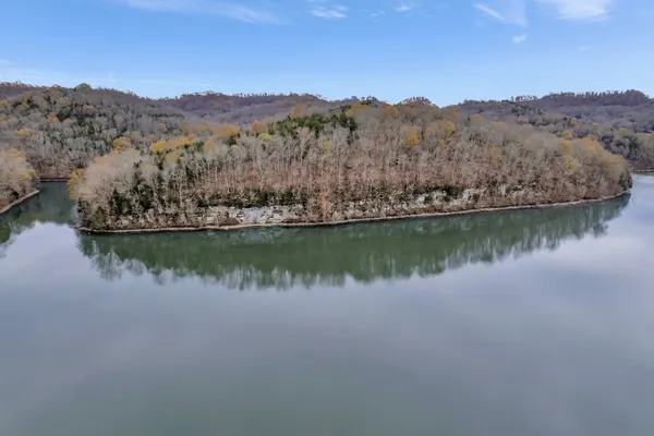 aerial view of a house with a lake view