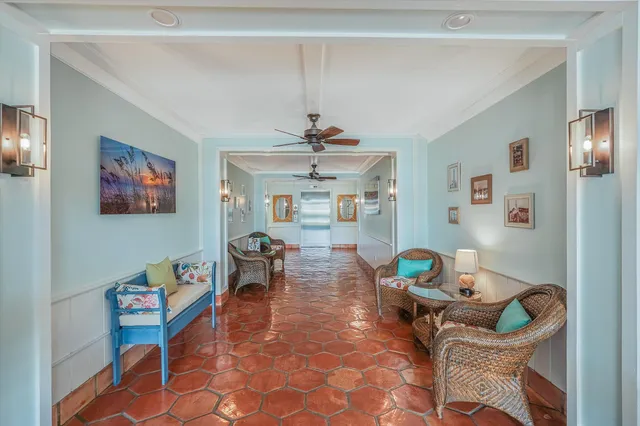a kitchen with stainless steel appliances granite countertop a sink refrigerator and cabinets