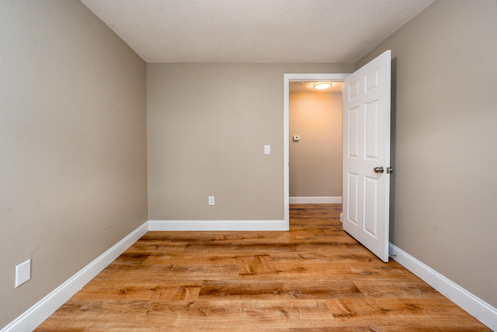 825 West Main Street, Unit 4 Hyannis, MA 02601 - Photo 12 of 20 an empty room with wooden floor and entrance