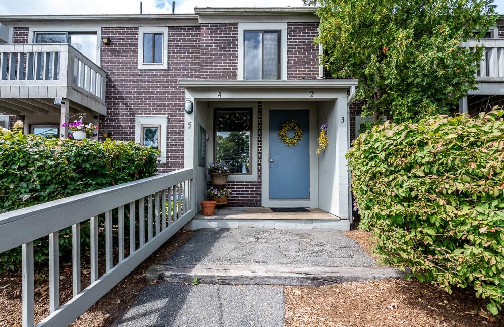 825 West Main Street, Unit 4 Hyannis, MA 02601 - Photo 2 of 20 a view of a house with potted plants