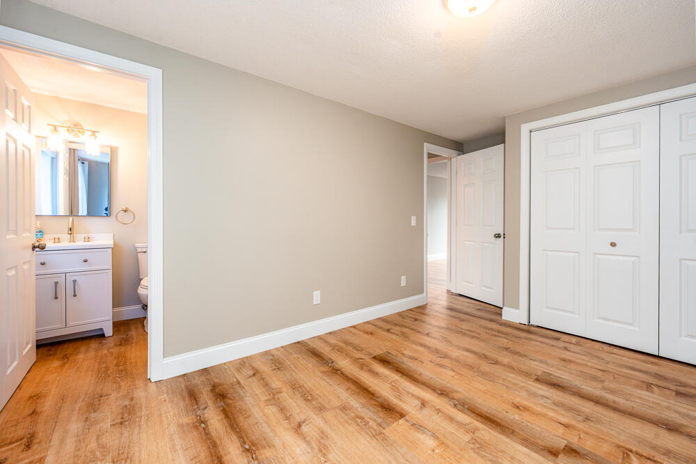 825 West Main Street, Unit 4 Hyannis, MA 02601 - Photo 6 of 20 a view of a room with wooden floor and a bathroom