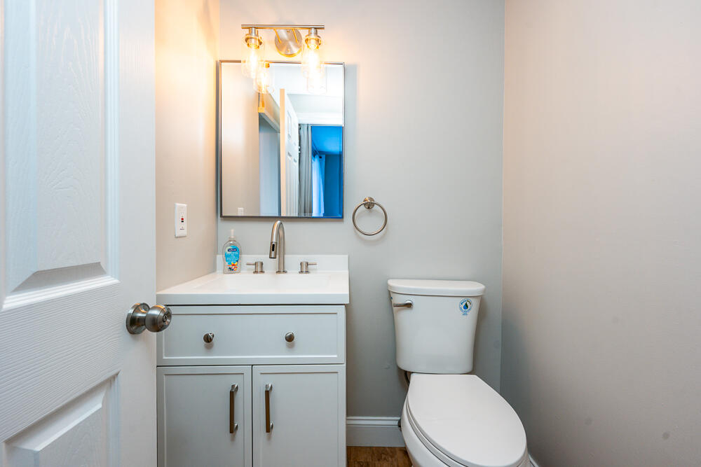 825 West Main Street, Unit 4 Hyannis, MA 02601 - Photo 8 of 20 a bathroom with a sink a toilet and a mirror